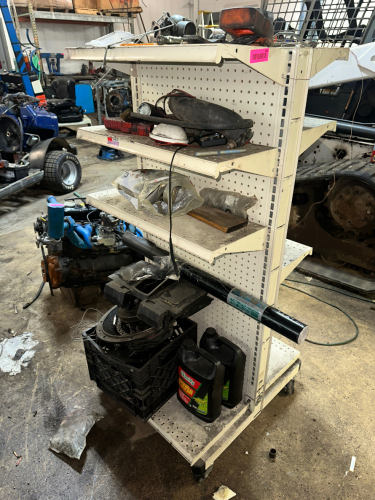 SHELF AND CONTENTS - ASSORTED HARDWARE, TOOLING, AND PARTS.