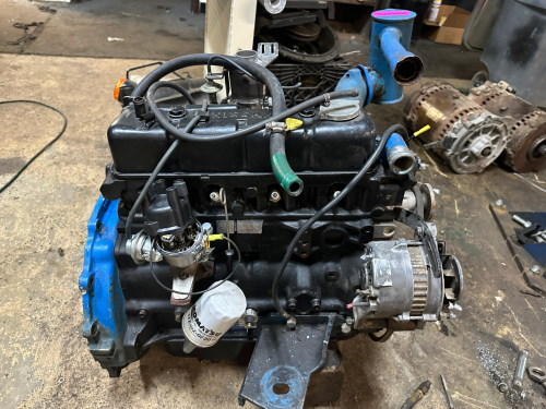 NISSAN ENGINE REMOVED FROM KOMATSU EQUIPMENT WITH CARBURETOR, DISTRIBUTOR, AND ACCESSORIES INSTALLED. IN WORKING ORDER