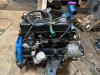 NISSAN ENGINE REMOVED FROM KOMATSU EQUIPMENT WITH CARBURETOR, DISTRIBUTOR, AND ACCESSORIES INSTALLED. IN WORKING ORDER