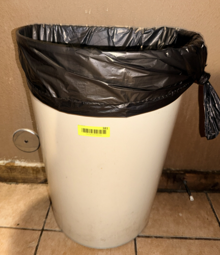 PLASTIC BATHROOM TRASH CAN.