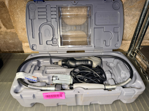 DREMEL TOOL W/ CASE AND ATTACHMENTS.