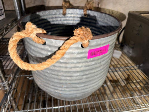 METAL BUCKET W/ ROPE HANDLES.