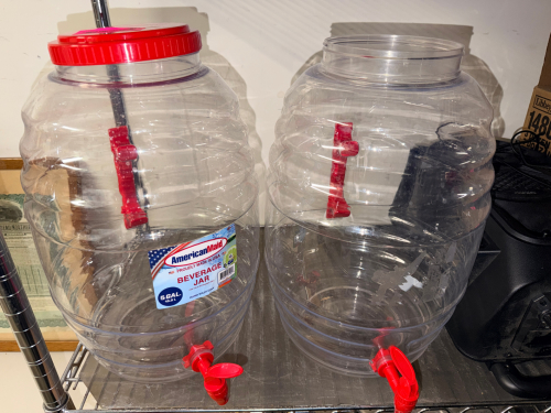 (2) PLASTIC BEVERAGE DECANTERS W/ NOZZLE.