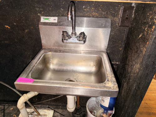 WALL MOUNTED STAINLESS HAND SINK.