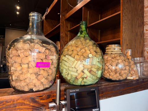 (4) ASSORTED GLASS JARS W/ CORK TOPS.