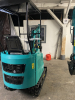 COMPACT TRACK MINI EXCAVATOR WITH OPEN CANOPY, RUBBER TRACKS, AND FRONT DOZER BLADE. EQUIPPED WITH HYDRAULIC BOOM, BUCKET, AND PILOT JOYSTICK CONTROLS. IDEAL FOR TRENCHING, LIGHT EXCAVATION, AND LANDSCAPING APPLICATIONS. - 7