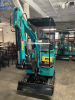 COMPACT TRACK MINI EXCAVATOR WITH OPEN CANOPY, RUBBER TRACKS, AND FRONT DOZER BLADE. FEATURES HYDRAULIC BOOM, BUCKET, AND PILOT JOYSTICK CONTROLS. IDEAL FOR LIGHT EXCAVATION, TRENCHING, AND LANDSCAPING APPLICATIONS. - 7