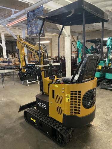 COMPACT TRACK MINI EXCAVATOR WITH OPEN CANOPY, RUBBER TRACKS, AND FRONT DOZER BLADE. FEATURES HYDRAULIC BOOM, BUCKET, AND PILOT JOYSTICK CONTROLS. SUITABLE FOR LIGHT CONSTRUCTION, TRENCHING, AND LANDSCAPING APPLICATIONS.