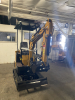 COMPACT TRACK MINI EXCAVATOR WITH OPEN CANOPY, RUBBER TRACKS, AND FRONT DOZER BLADE. FEATURES HYDRAULIC BOOM, BUCKET, AND PILOT JOYSTICK CONTROLS. SUITABLE FOR LIGHT CONSTRUCTION, TRENCHING, AND LANDSCAPING APPLICATIONS. - 7