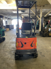 COMPACT TRACK MINI EXCAVATOR WITH OPEN CANOPY, RUBBER TRACKS, AND FRONT DOZER BLADE. EQUIPPED WITH HYDRAULIC BOOM AND BUCKET, SIDE CONTROL JOYSTICKS, AND REAR ENGINE COMPARTMENT. COMPACT DESIGN SUITABLE FOR LIGHT CONSTRUCTION AND TRENCHING APPLICATIONS. - 5