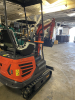 COMPACT TRACK MINI EXCAVATOR WITH OPEN CANOPY, RUBBER TRACKS, AND FRONT DOZER BLADE. EQUIPPED WITH HYDRAULIC BOOM AND BUCKET, SIDE CONTROL JOYSTICKS, AND REAR ENGINE COMPARTMENT. COMPACT DESIGN SUITABLE FOR LIGHT CONSTRUCTION AND TRENCHING APPLICATIONS. - 6