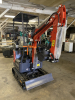 COMPACT TRACK MINI EXCAVATOR WITH OPEN CANOPY, RUBBER TRACKS, AND FRONT DOZER BLADE. EQUIPPED WITH HYDRAULIC BOOM AND BUCKET, SIDE CONTROL JOYSTICKS, AND REAR ENGINE COMPARTMENT. COMPACT DESIGN SUITABLE FOR LIGHT CONSTRUCTION AND TRENCHING APPLICATIONS. - 7