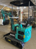 COMPACT TRACK MINI EXCAVATOR WITH OPEN CAB, RUBBER TRACKS, AND FRONT DOZER BLADE. HYDRAULIC BOOM WITH BUCKET ATTACHMENT AND CONTROL LEVERS. UNIT FEATURES PROTECTIVE CANOPY, REAR ENGINE ACCESS, AND COMPACT FRAME DESIGN. - 2