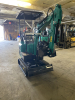 COMPACT TRACK MINI EXCAVATOR WITH OPEN CAB, RUBBER TRACKS, AND FRONT DOZER BLADE. HYDRAULIC BOOM WITH BUCKET ATTACHMENT AND CONTROL LEVERS. UNIT FEATURES PROTECTIVE CANOPY, REAR ENGINE ACCESS, AND COMPACT FRAME DESIGN. - 7