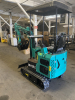 COMPACT TRACK MINI EXCAVATOR WITH OPEN CAB, RUBBER TRACKS, AND FRONT BLADE. HYDRAULIC BOOM WITH BUCKET ATTACHMENT AND CONTROL LEVER OPERATION. UNIT FEATURES PROTECTIVE CANOPY, REAR ENGINE COMPARTMENT, AND COMPACT BODY DESIGN. - 2