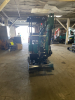 COMPACT TRACK MINI EXCAVATOR WITH OPEN CAB, RUBBER TRACKS, AND FRONT BLADE. HYDRAULIC BOOM WITH BUCKET ATTACHMENT AND CONTROL LEVER OPERATION. UNIT FEATURES PROTECTIVE CANOPY, REAR ENGINE COMPARTMENT, AND COMPACT BODY DESIGN. - 7