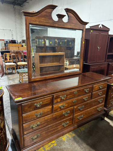 VINTAGE STYLE WOODEN DRESSER WITH AN ATTACHED MIRROR AND BRASS HANDLES