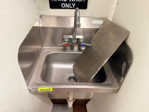 WALL MOUNTED STAINLESS HAND SINK.
