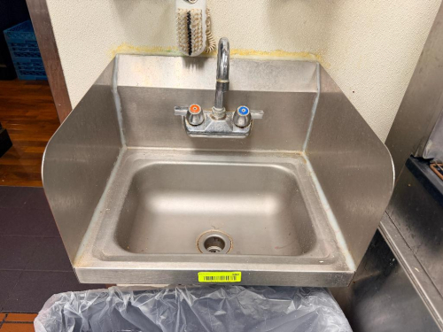 WALL MOUNTED STAINLESS HAND SINK.