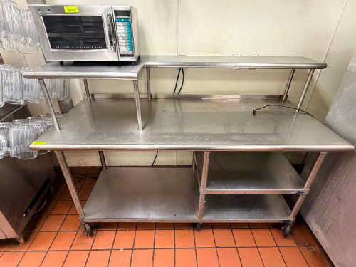 60"W X 30"D STAINLESS STEEL WORK / PREP TABLE WITH DOUBLE OVER SHELF AND UNDERSHELF STORAGE. UNIT FEATURES RAISED DOUBLE-TIER SHELVING FOR EQUIPMENT OR STORAGE, LOWER SHELF, AND CASTER