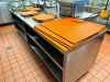 120"W X 32"D STAINLESS STEEL WORK / PREP TABLE WITH UNDERSHELF STORAGE AND FILM / WRAP DISPENSER. UNIT FEATURES HEAVY-DUTY CONSTRUCTION, OPEN BASE SHELVING FOR STORAGE, AND CASTERS - 6