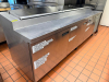 112"W THREE-DOOR PREP TABLE / SANDWICH UNIT WITH RAISED INGREDIENT ICE RAIL AND HINGED LIDS. UNIT FEATURES STAINLESS STEEL CONSTRUCTION, REFRIGERATED BASE STORAGE, AND CUTTING/WORK SURFACE.