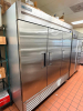 TRUE T-72-HC THREE-DOOR REACH-IN REFRIGERATOR WITH BOTTOM-MOUNT COMPRESSOR AND STAINLESS STEEL EXTERIOR/INTERIOR. UNIT FEATURES DIGITAL TEMPERATURE CONTROL, FORCED-AIR COOLING, AND ADJUSTABLE WIRE SHELVING
