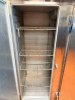 CONTINENTAL THREE DOOR REACH-IN REFRIGERATOR WITH TOP-MOUNT COMPRESSOR HOUSING. UNIT FEATURES THREE SOLID SWING DOORS, MULTIPLE INTERIOR WIRE SHELVES, AND CASTERS - 3