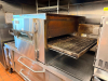 LINCOLN CONVEYOR OVEN WITH FRONT-LOAD DOOR AND EXTENDED CONVEYOR BELT SYSTEM. UNIT FEATURES DIGITAL CONTROL PANEL, VIEWING WINDOW - 3