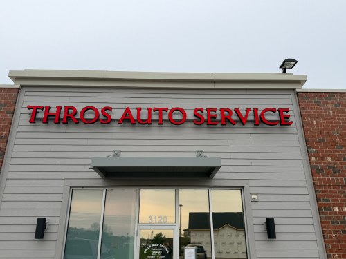 THROS AUTO SERVICE LIGHTED STORE FRONT SIGN.