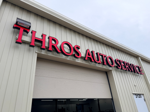 THROS AUTO SERVICE LIGHTED STORE FRONT SIGN.