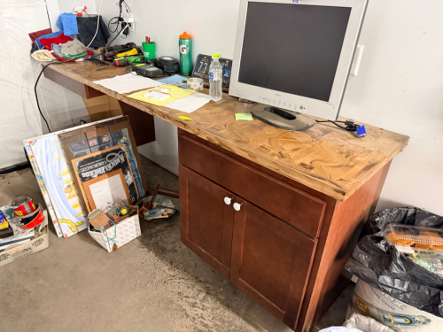 8' X 20' WOODEN SHOP DESK.