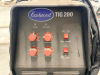 EASTWOOD TIG WELDER PACKAGE MOUNTED ON MOBILE CART WITH GAS CYLINDER, REGULATOR, TORCH, AND LEADS. CONTROL PANEL FEATURES ADJUSTABLE SETTINGS FOR POWER, CLEARANCE EFFECT, PRE FLOW, AND POST FLOW WITH AC/DC SELECTION. - 3