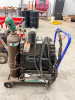 EASTWOOD TIG WELDER PACKAGE MOUNTED ON MOBILE CART WITH GAS CYLINDER, REGULATOR, TORCH, AND LEADS. CONTROL PANEL FEATURES ADJUSTABLE SETTINGS FOR POWER, CLEARANCE EFFECT, PRE FLOW, AND POST FLOW WITH AC/DC SELECTION. - 4