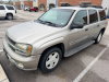TAN CHEVROLET TRAILBLAZER LT WITH AUTOMATIC TRANSMISSION, 4WD, ROOF RACK, RUNNING BOARDS, AND FACTORY ALLOY WHEELS.