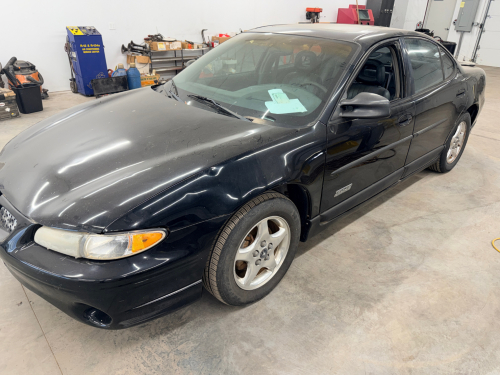 PONTIAC GRAND PRIX GTP WITH AUTOMATIC TRANSMISSION, FACTORY ALLOY WHEELS, AND REAR SPOILER. EQUIPPED WITH 3800 SERIES SUPERCHARGED ENGINE. SHOWS WEAR INCLUDING PAINT FADE, SCRATCHES, AND BODY DAMAGE AS PICTURED.
