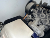 VERTICAL AIR COMPRESSOR WITH BELT-DRIVEN MOTOR, PROTECTIVE FAN SHROUD, AND MOUNTED TANK. UNIT INCLUDES HOSES, FITTINGS, AND MANUAL AS SHOWN. COMPRESSOR ASSEMBLY MOUNTED ON STORAGE SKID. - 5