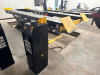 12,000 LB. CAPACITY HEAVY DUTY IN-GROUND SCISSOR VEHICLE LIFT WITH DUAL RUNWAYS AND INTEGRATED CENTER JACK, HYDRAULIC SYSTEM WITH STANDALONE CONTROL COLUMN. WITH DATA PLATES AND SAFETY LABELS PRESENT. SOLID INDUSTRIAL CONSTRUCTION WITH 12,000 LB. MAIN LI
