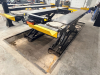 12,000 LB. CAPACITY HEAVY DUTY IN-GROUND SCISSOR VEHICLE LIFT WITH DUAL RUNWAYS AND INTEGRATED CENTER JACK, HYDRAULIC SYSTEM WITH STANDALONE CONTROL COLUMN. WITH DATA PLATES AND SAFETY LABELS PRESENT. SOLID INDUSTRIAL CONSTRUCTION WITH 12,000 LB. MAIN LI - 11