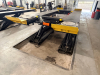 12,000 LB. CAPACITY HEAVY DUTY IN-GROUND SCISSOR VEHICLE LIFT WITH INTEGRATED CENTER JACK, HYDRAULIC OPERATION, AND FULL LENGTH RUNWAYS. UNIT FEATURES DUAL PLATFORM DESIGN WITH YELLOW APPROACH RAMPS AND CONTROL STATION, IDENTIFICATION PLATES AND SAFETY CE - 13