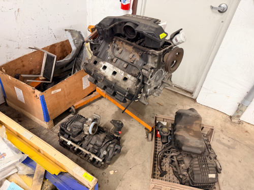 ENGINE, ENGINE PARTS, AND ENGINE STAND.
