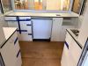 OUTDOOR KIOSK UNIT WITH GLASS SERVICE WINDOWS, INTERIOR CABINETRY, MULTIPLE SINK BASINS, UNDERCOUNTER REFRIGERATION, AND ROOF MOUNTED HVAC UNIT. UNIT FEATURES PAINTED METAL EXTERIOR, ACCESS DOOR, INTERIOR LIGHTING, ELECTRICAL PANEL, AND PLUMBING CONNECTIO - 13