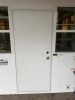 OUTDOOR KIOSK UNIT WITH GLASS SERVICE WINDOWS, INTERIOR CABINETRY, MULTIPLE SINK BASINS, UNDERCOUNTER REFRIGERATION, AND ROOF MOUNTED HVAC UNIT. UNIT FEATURES PAINTED METAL EXTERIOR, ACCESS DOOR, INTERIOR LIGHTING, ELECTRICAL PANEL, AND PLUMBING CONNECTIO - 21