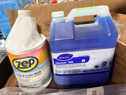 (1) BOTTLES OF TRUCK WASH AND (1) BOTTLE OF GLASS AND SURFACE CLEANER.