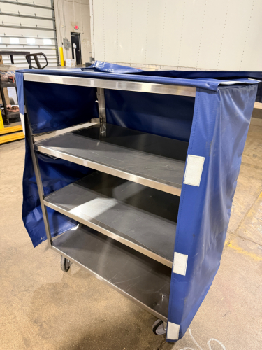 36" X 24" FOUR TIER STAINLESS UTILITY CART W/ VINYL COVER.