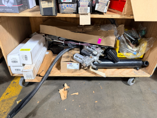 CONTENTS OF BOTTOM SHELF - ASSORTED TRUCK PARTS.