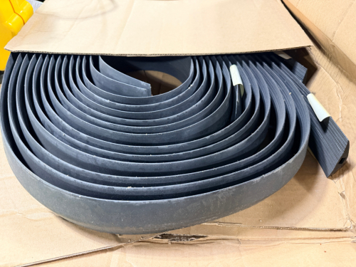 COILED INDUSTRIAL RUBBER STRIP / EDGE GUARD MATERIAL, FLEXIBLE DESIGN FOR PROTECTION, SEALING, OR BARRIER APPLICATIONS