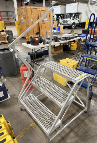 THREE STEP ROLLING METAL STAIR CASE W/ LEFT HAND RAILING.