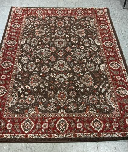 (1) BROWN AND RED PATTERN RUG