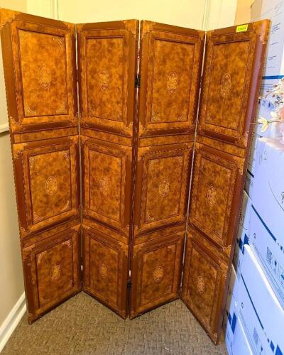 FOUR-PANEL FOLDING ROOM DIVIDER SCREEN WITH LEATHER-UPHOLSTERED PANELS, FEATURING EMBOSSED DECORATIVE MEDALLIONS, STITCHED BORDERS, AND STUDDED CORNER ACCENTS WITH HINGED CONNECTIONS.